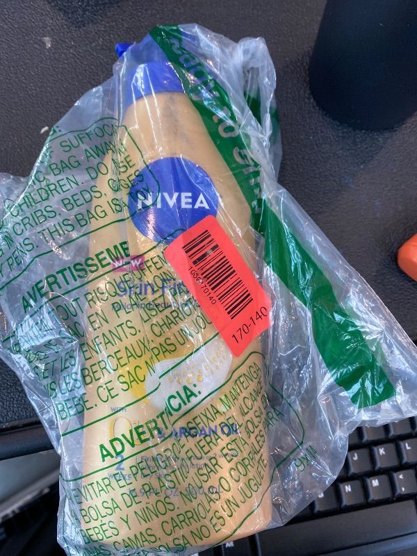 Photo 1 of ***BROKEN CAP*** NIVEA Skin Firming Melanin Beauty & Hydration Body Lotion with Q10 and Argan Oil, Firmer Skin in as Little As Seven Days, 16.9 Fl Oz Pump Bottle