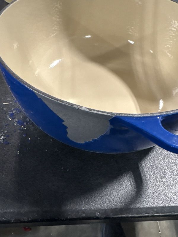 Photo 1 of *DAMAGED**
Lodge 6 Quart Enameled Cast Iron Dutch Oven with Lid – Dual Handles – Oven Safe up to 500° F or on Stovetop - Use to Marinate, Cook, Bake, Refrigerate and Serve – Indigo