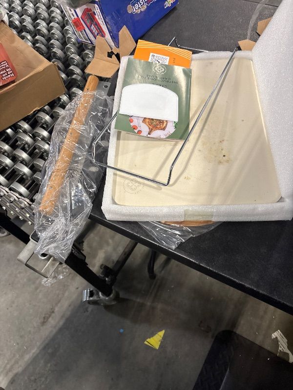 Photo 1 of **VERY USED**
Pizza Stone for Oven and Grill Set - 5PCS Pizza Making Accessories Kit - 15 inch Pizza Stone with Handles, Pizza Peel, Pizza Cutter, Dough Tool - Baking Stone for Bread - Large Rectangular Oven Stones