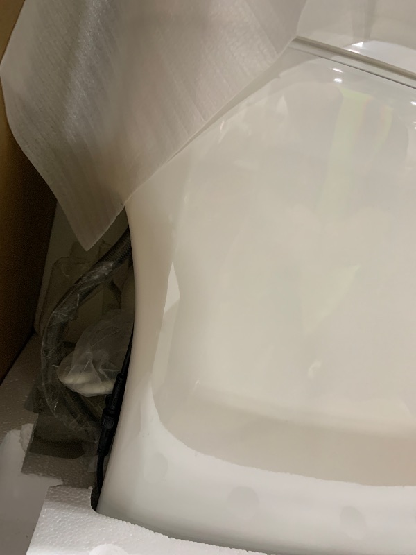 Photo 1 of WOODBRIDGE Smart Toilet, Auto Open & Close, Auto Flush, Foot Sensor Operation, Heated Seat and Integrated Multi Function Remote Control in White