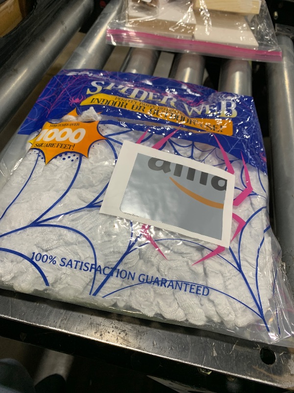 Photo 1 of 1000 sqft Spider Webs Halloween Decorations Bonus with 30 Fake Spiders, Super Stretch Cobwebs for Halloween Indoor and Outdoor Party Supplies