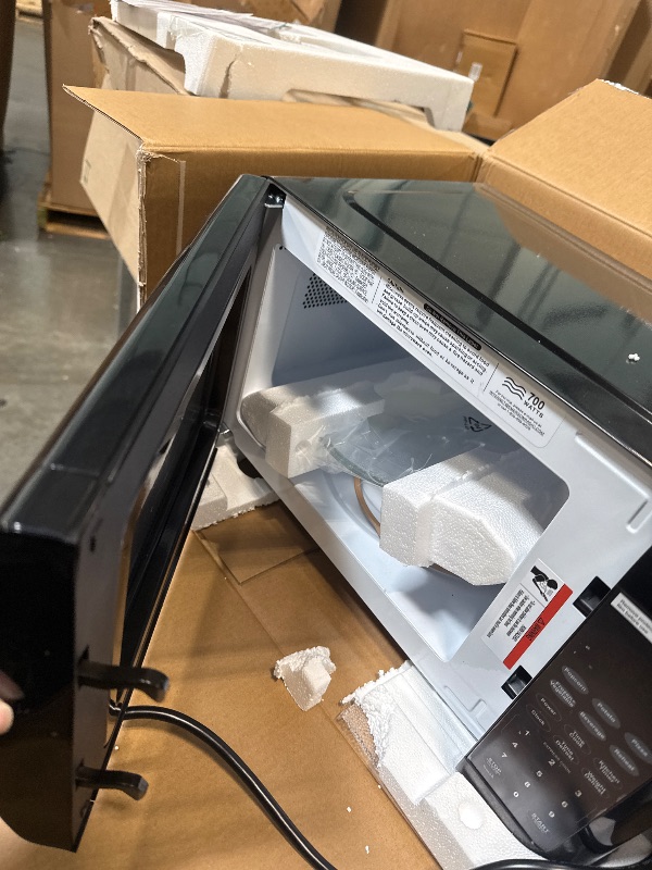 Photo 1 of ***DAMAGE MINOR*** Emerson MW7302B Compact Countertop Microwave Oven with Touch Control, LED Display, 700W, 10 Power Levels, 6 Auto Menus, Glass Turntable and Child Safe Lock, 0.7 Cu., Ft. Black