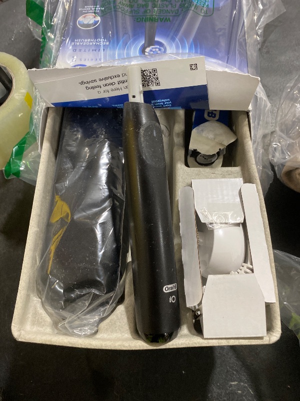 Photo 1 of Oral-B iO Simple Clean Rechargeable Electric Powered Toothbrush, Night Black with 1 Gentle Care Brush Head and 1 Black Travel Case - Automatic Pressure Sensor to Protect Gums - 3 Modes - 2 Min Timer