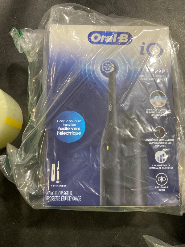 Photo 1 of Oral-B iO Simple Clean Rechargeable Electric Powered Toothbrush, Night Black with 1 Gentle Care Brush Head and 1 Black Travel Case - Automatic Pressure Sensor to Protect Gums - 3 Modes - 2 Min Timer