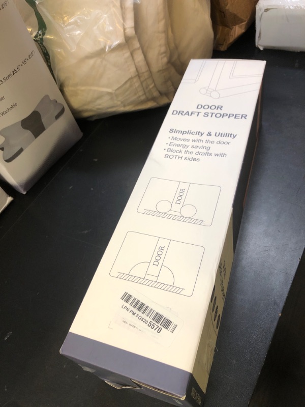 Photo 1 of MAGZO Door Draft Stopper, 30 Inch Adjustable Under Door Gap Filler, Fits 26'' - 30'' Bottom Widths, Seals Gaps up to 1.7", Soundproof Sweep Blocks Air, Noise, Light, Dust- Grey