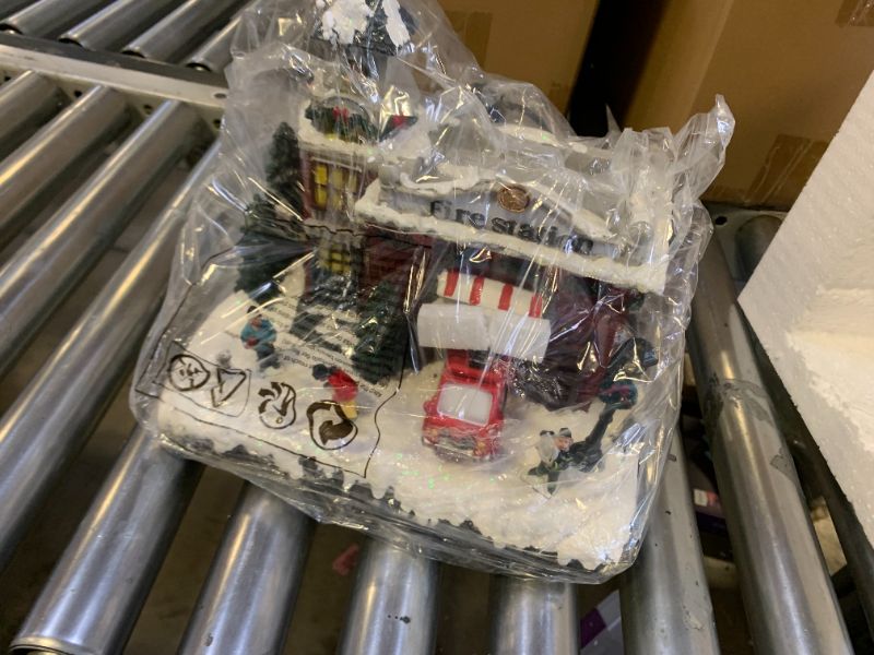 Photo 1 of Resin Christmas Village Building, Fire Station with LED Lights & Multiple Music Tracks, Collectible Buildings Decoration with Snow, Indoor Home & Desktop Holiday Gift (10" H x 11" W x 7.5" D)