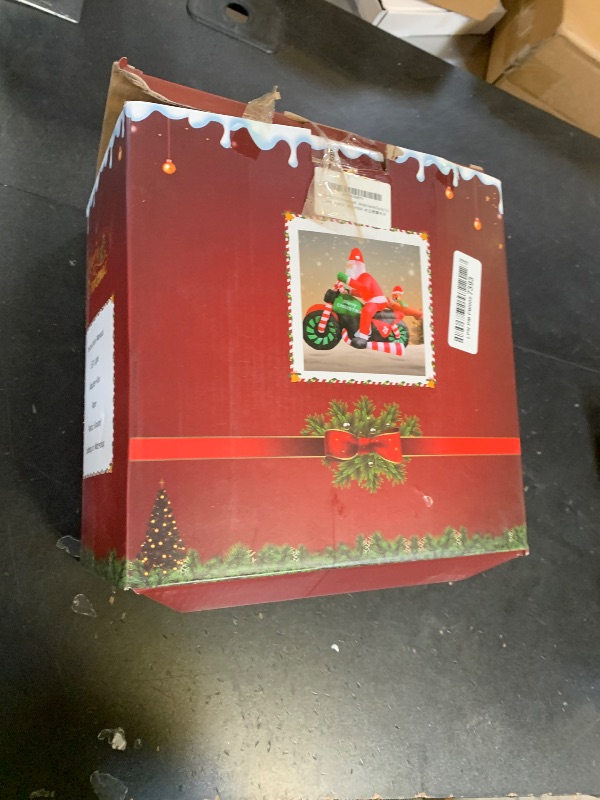 Photo 1 of **SELLING FOR PARTS**6FT Christmas Decoration Inflatable Santa Riding Motorcycle with Gingerbread Man Lighted Blow Up Santa Claus Outdoor Decor for Holiday, Party, Yard, Lawn, Garden, Winter Festive Display Fun