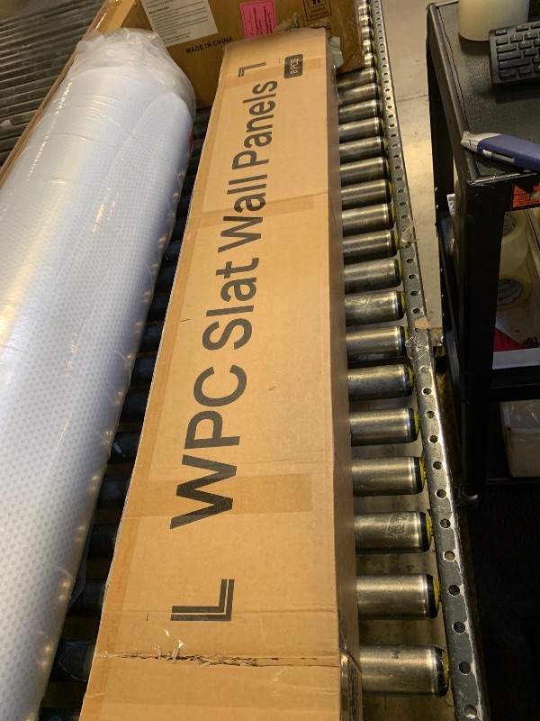 Photo 1 of LARWORKS WPC Slat Wall Panels 8 Pack 96" x 6.6", Waterproof Fluted Wall Paneling, Accent 3D Wall Panel for Wall Decor, Bathroom, Bedroom, Office - High Grille Elm (Cover Approx.35 sq.ft)