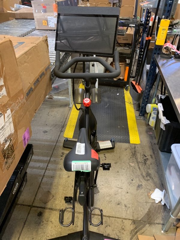 Photo 1 of Peloton Exercise Cross Training Bike, Indoor Stationary Spin Bike for Home Workouts, Space-Friendly Exercise Equipment for Cardio and strength Workout & Indoor Cycling