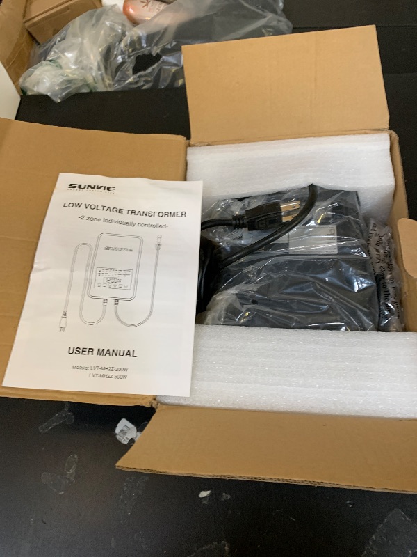 Photo 1 of SUNVIE 300W Low Voltage Landscape Transformer with 2 Independent Control Output Landscape Lighting Transformer with Timer and Photocell Sensor 120V AC to 12/14V AC Weatherproof Low Voltage Transformer