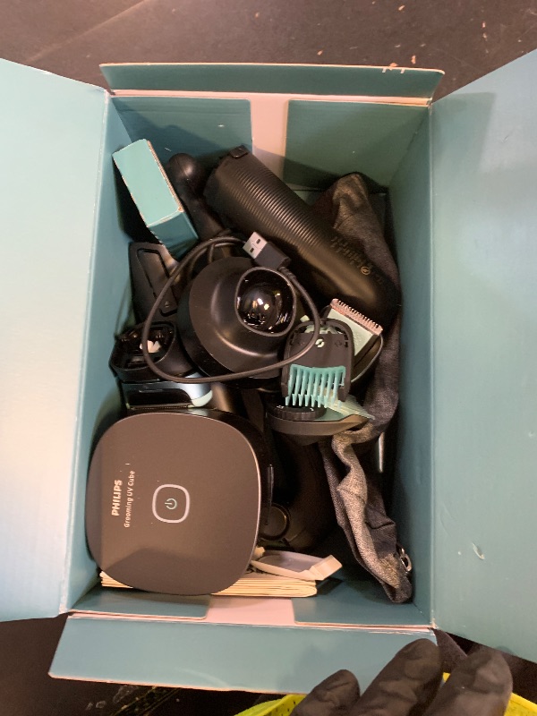 Photo 1 of Philips Norelco Body Groomer 9000 Series, Intimate Trimmer for Bi-directional Use & Waterproof Wet Dry Body Shaver System with Foldable Back Attachment & UV Cube Cleaner, BG9485/50