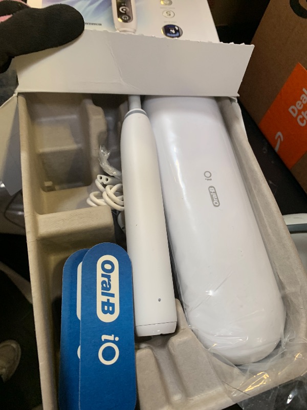 Photo 1 of Oral-B iO Deep Clean + Protect Rechargeable Electric Toothbrush, White, iO Series 7, 2 Replacement Brush Heads, Charging Travel Case