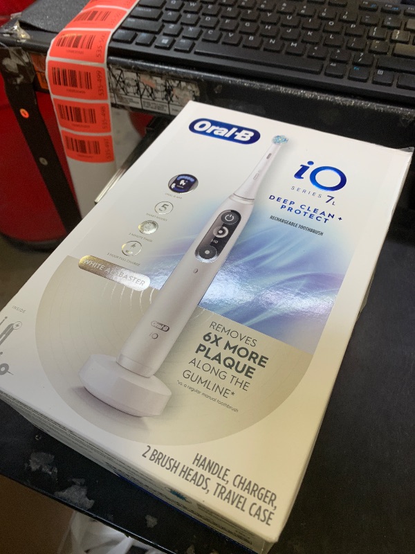 Photo 1 of Oral-B iO Deep Clean + Protect Rechargeable Electric Toothbrush, White, iO Series 7, 2 Replacement Brush Heads, Charging Travel Case