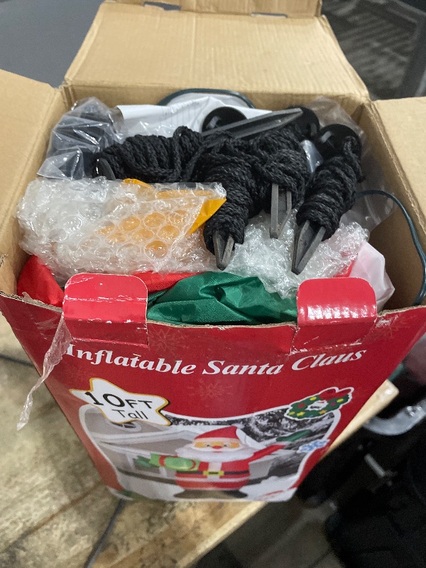 Photo 1 of 10 FT Christmas Inflatable Santa Claus Outdoor Decorations, Blow Up Santa Claus Holding Gift Box for Xmas Outside Decor, Giant Santa with Bright LED Lights for Yard Patio Garden Lawn Holiday Party