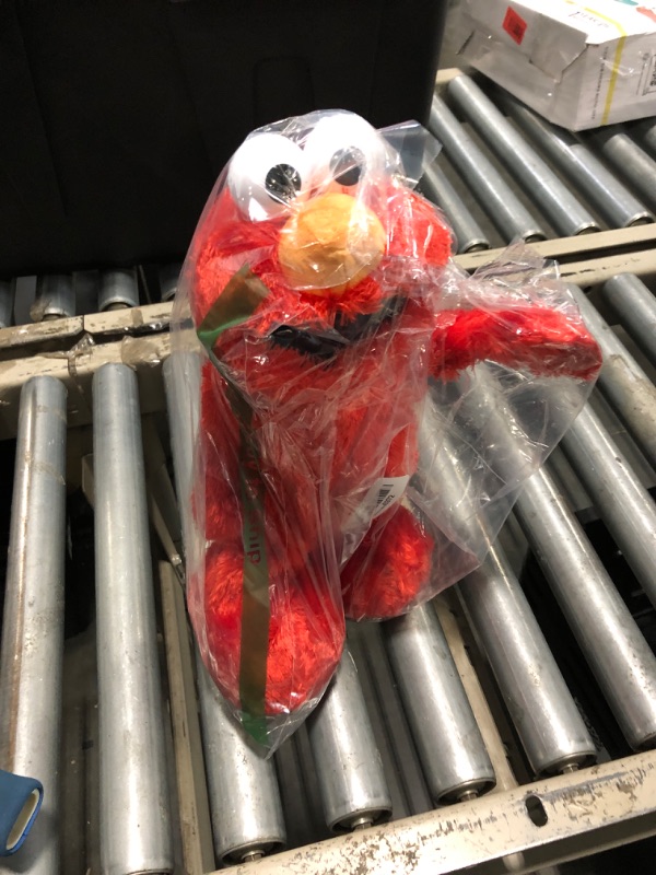 Photo 1 of ***Electronics Damaged****Sesame Street Hokey Pokey Elmo 14” Interactive Plush Toy, Sings, Dances & Plays Music, Bilingual Stuffed Animal for Pretend Play, Soft & Huggable, Ages 18 Months and Up by Just Play