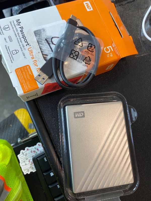 Photo 1 of *UNTESTED*
WD 5TB My Passport Ultra for Mac Silver, Portable External Hard Drive, backup software with defense against ransomware, and password protection, USB-C and USB 3.1 - WDBPMV0050BSL-WESN