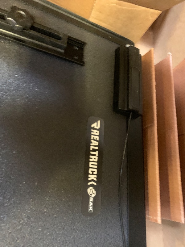 Photo 1 of missing multiple pieces-------------------------------------selling for parts only-------------------------------------------------RealTruck BAK BAKFlip MX4 Hard Folding Truck Bed Tonneau Cover | 448203RB | Fits 2012 - 2023 Dodge Ram 1500, 2012-21 2500/35