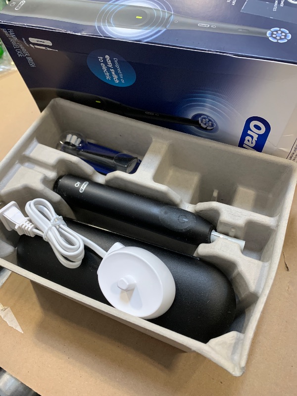 Photo 1 of Oral-B iO Simple Clean Rechargeable Electric Powered Toothbrush, Night Black with 1 Gentle Care Brush Head and 1 Black Travel Case - Automatic Pressure Sensor to Protect Gums - 3 Modes - 2 Min Timer