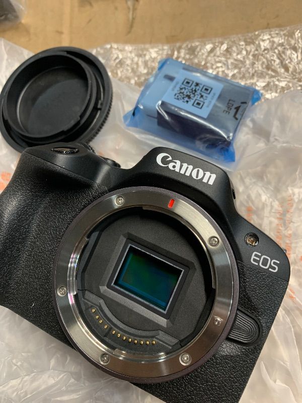 View 6 of *missing 2 lens and a battery* see photos for contents* Canon EOS R50 Mirrorless Camera with RF 24-50mm f/4.5-6.3 IS STM And EF 75-300mm f/4-5.6 III & 420-800mm f/8 Lens + Mount Adapter + 128 GB Memory + Extra Battery + More (28pc Bundle)