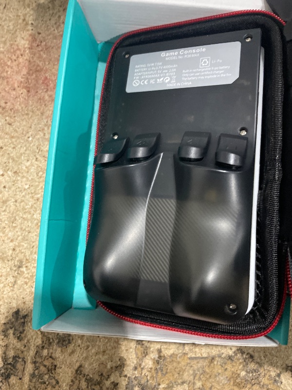 Photo 1 of ?R36MAX 4000mAh Portable Rechargeable Handheld Retro Game Console,Comfort Non-Slip Handheld Standing Retro Game Console with 64G TF Car,4.0-inch Screen,for Office,Black