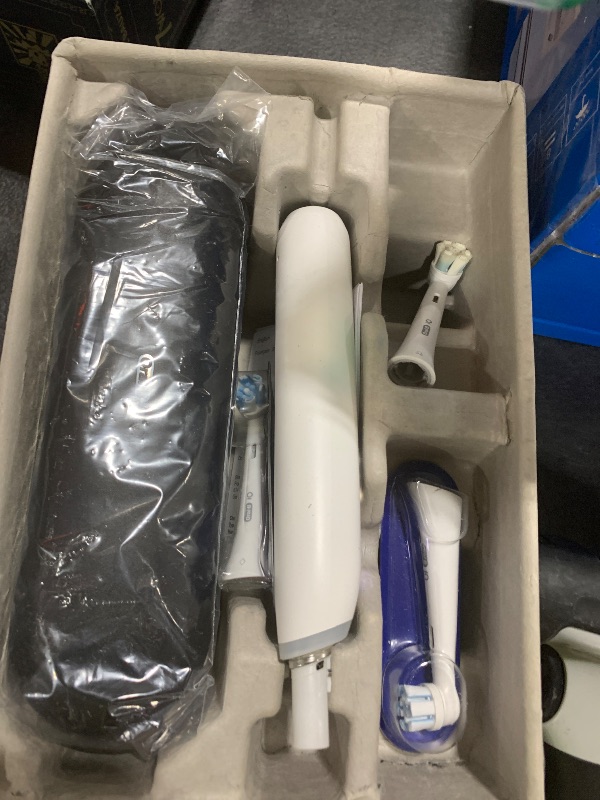 Photo 3 of Oral-B iO Deep Clean + Whiten Rechargeable Electric Toothbrush with Visible Pressure Sensor, 2 Minute Timer, 5 Cleaning Settings, 1 iO5 Limited, 3 Toothbrush Heads, Travel Case & Refill Holder, White