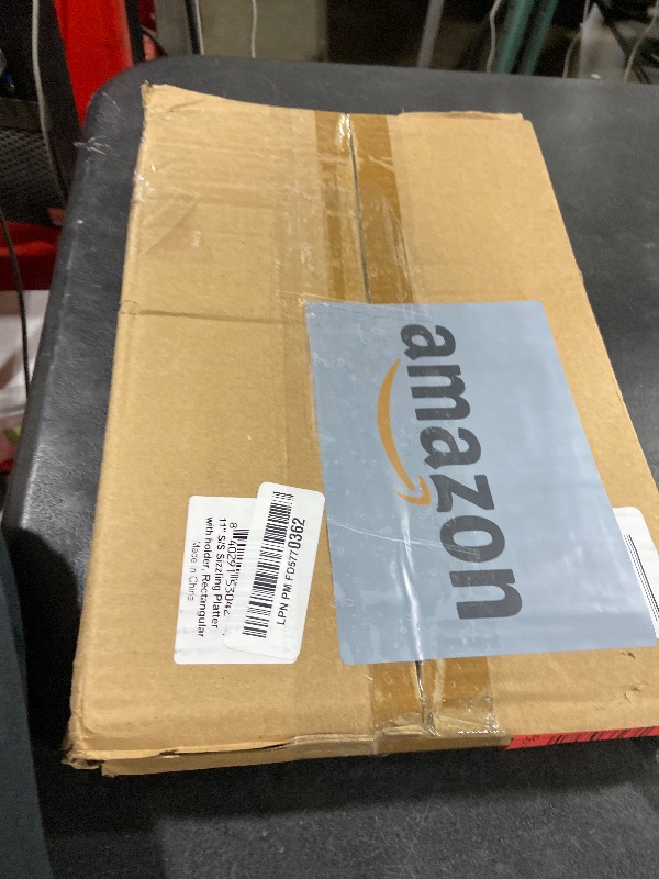 Photo 1 of New Star Foodservice 26672 Rectangular Stainless Steel Sizzling Platter with Insulated Holder, 11" x 7.25", Black