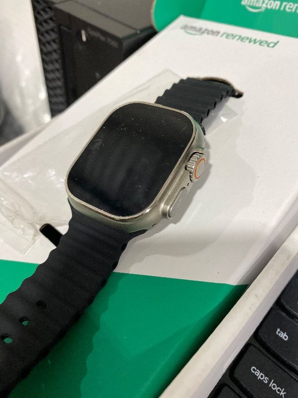 Photo 1 of Apple Watch Ultra [GPS + Cellular 49mm] Titanium Case with Midnight Ocean Band, One Size (Renewed Premium)