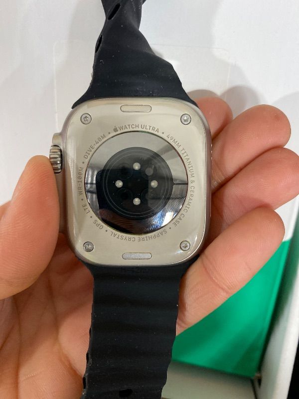 Photo 1 of Apple Watch Ultra [GPS + Cellular 49mm] Titanium Case with Midnight Ocean Band, One Size (Renewed Premium)
