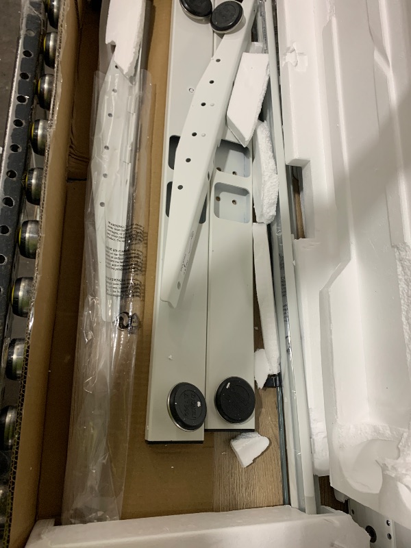 Photo 1 of SHW 55 x 28 Inches Electric Height Adjustable Standing Desk with Drawer and Memory Preset, Maple