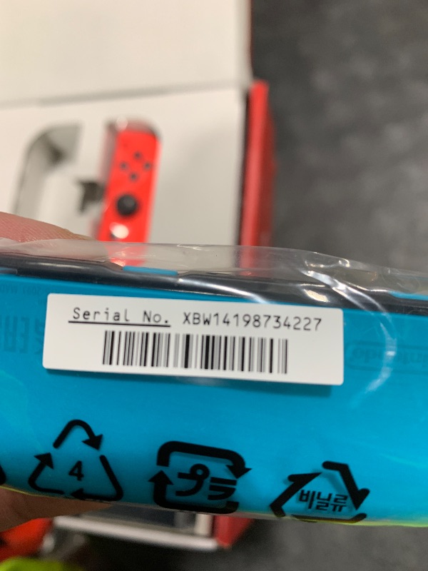 Photo 1 of ITEM NON FUNCTIONAL ---------------------------- PARTS ONLY ---------------------------------------------------------------------------Nintendo Switch™ with Neon Blue and Neon Red Joy?Con™