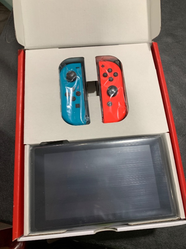 Photo 1 of ITEM NON FUNCTIONAL ---------------------------- PARTS ONLY ---------------------------------------------------------------------------Nintendo Switch™ with Neon Blue and Neon Red Joy?Con™