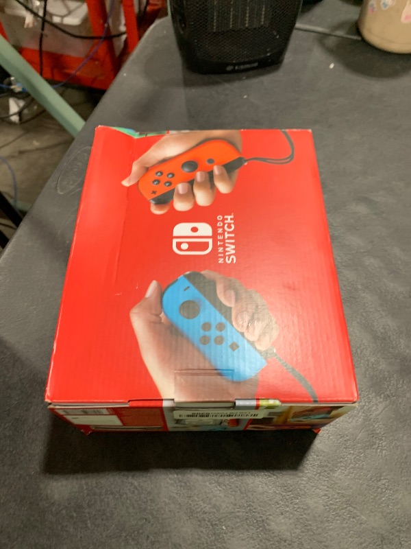 Photo 1 of ITEM NON FUNCTIONAL ---------------------------- PARTS ONLY ---------------------------------------------------------------------------Nintendo Switch™ with Neon Blue and Neon Red Joy?Con™