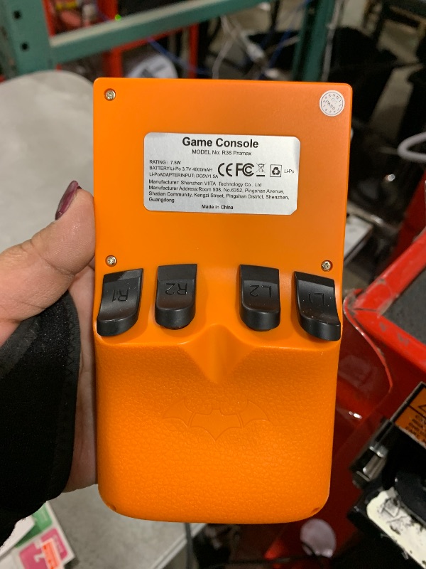 Photo 1 of R36 PROMAX Retro Handheld Game Console,4.0 Inch Full-Lamination IPS Screen Retro Gaming Console,Linux System,Built-in 64GB Memory Retro Game Console,Portable Arcade Video Gaming Console