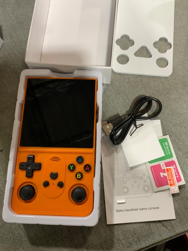 Photo 1 of R36 PROMAX Retro Handheld Game Console,4.0 Inch Full-Lamination IPS Screen Retro Gaming Console,Linux System,Built-in 64GB Memory Retro Game Console,Portable Arcade Video Gaming Console