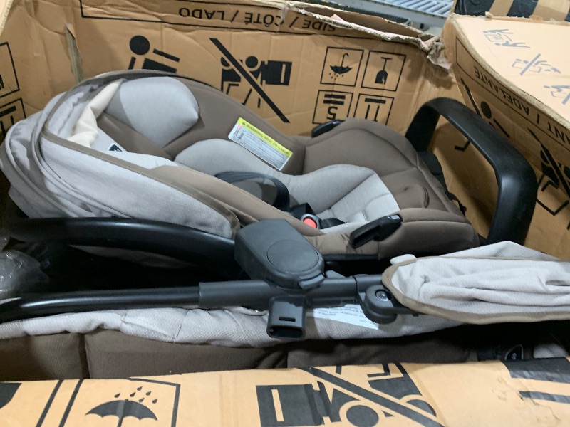 Photo 1 of Evenflo Pivot Modular Travel System with LiteMax Infant Car Seat with Anti-Rebound Bar (Desert Tan)