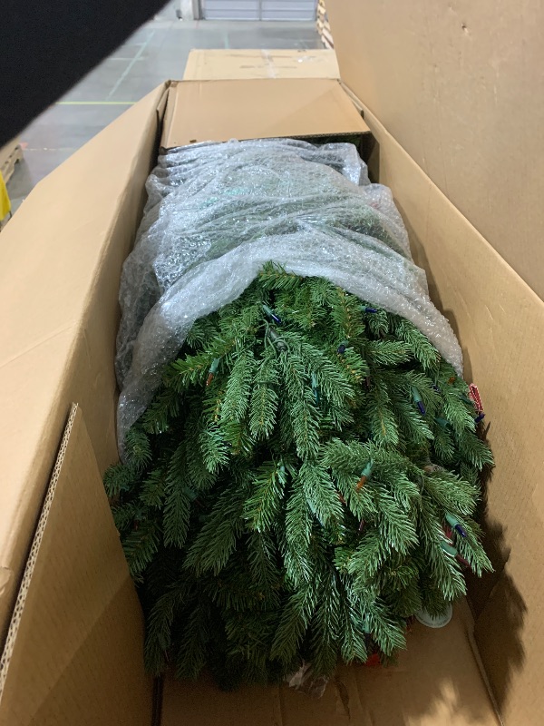 Photo 1 of National Tree Company 7.5 ft Pre-Lit Jersey Fraser Fir Full Artificial Christmas Tree, 1,250 Multicolor Lights, 3,144 Tips, Includes Stand, Green