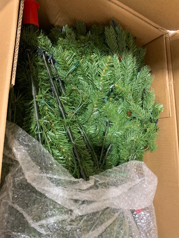 Photo 1 of National Tree Company 7.5 ft Pre-Lit Jersey Fraser Fir Full Artificial Christmas Tree, 1,250 Multicolor Lights, 3,144 Tips, Includes Stand, Green