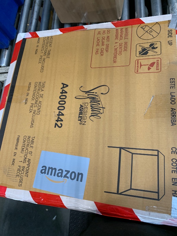 Photo 1 of ***FINAL SALE/NO RETURN, VIEW NOTES*** Signature Design by Ashley Ryandale | Contemporary Accent Table – Glass Top, Aluminum Frame & Marble Shelf, Antique Brass Finish