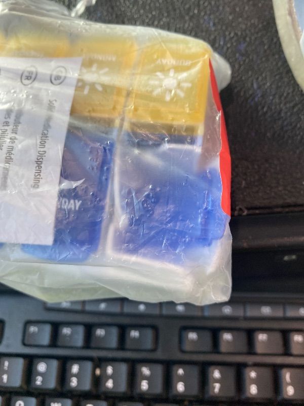Photo 1 of ***MAJOR DAMAGE*** EZY DOSE Weekly (7-Day) AM/PM Pill Organizer, Daily Vitamin Container and Medicine Box, Large Pop-Out Compartments, Designed for Travel, 2 Times a Day, Blue and Yellow Lids