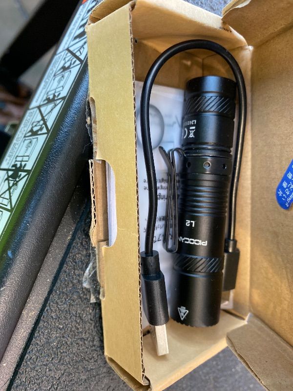 Photo 1 of **MAJOR DAMAGE**
PIOOCAN Rechargeable Flashlights 1200 Lumens EDC Flashlight, AA Pocket Flashlight High Lumens with Clip, Super Bright Small Flashlights, 4 Modes Flash Light for Camping, Home, and Emergencies (Black)