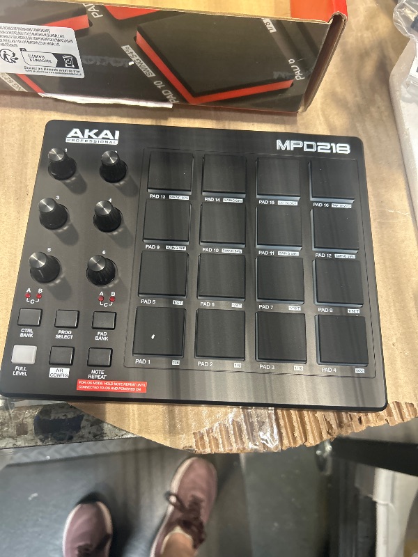 Photo 1 of ** SOLD AS IS, NO REFUND/RETURN** SEE COMMENTS
Akai Professional MPD218 - USB MIDI Controller with 16 MPC Drum Pads, 6 Assignable Knobs, Note Repeat and Full Level Buttons and Production Software