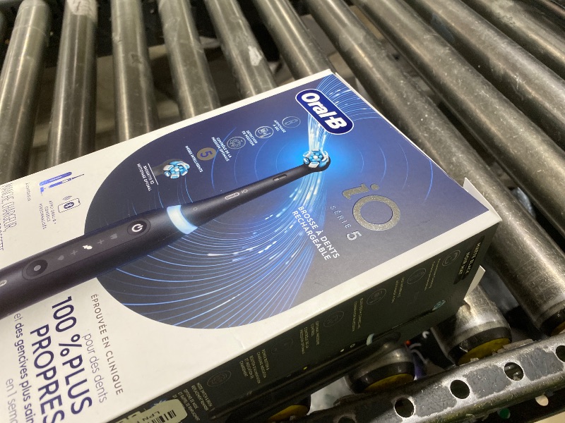 Photo 1 of Oral-B Rechargeable Electric Toothbrush, iO5 Customizable Clean, 5 Cleaning Modes, Visual Pressure Sensor to Protect Gums, Travel Case, Black