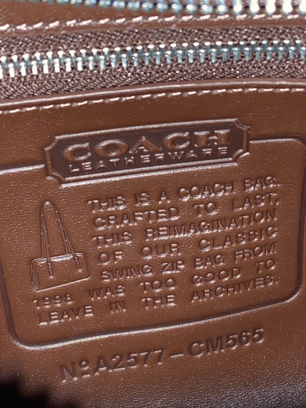 Photo 1 of COACH Women's Swing Zip Bag, LH/Maple, One Size