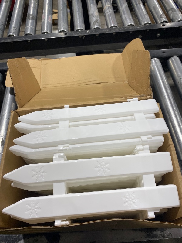 Photo 1 of WHITE PLASTIC FENCE DECOR 