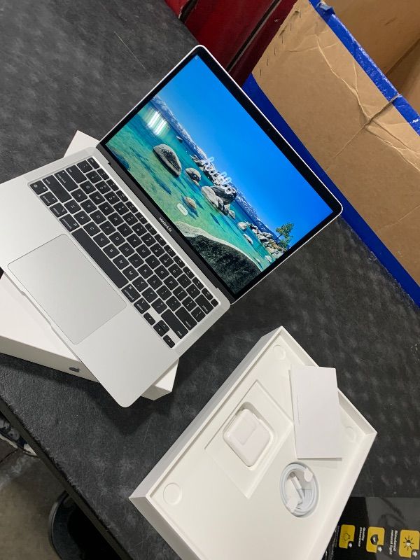 Photo 1 of 2020 Apple MacBook Air Laptop: Apple M1 Chip, 13” Retina Display, 8GB RAM, 256GB SSD Storage, Backlit Keyboard, FaceTime HD Camera, Touch ID. Works with iPhone/iPad; Silver