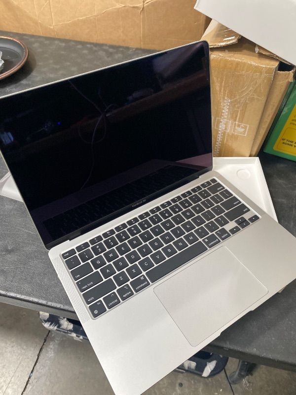 Photo 1 of 2020 Apple MacBook Air Laptop: Apple M1 Chip, 13” Retina Display, 8GB RAM, 256GB SSD Storage, Backlit Keyboard, FaceTime HD Camera, Touch ID. Works with iPhone/iPad; Silver