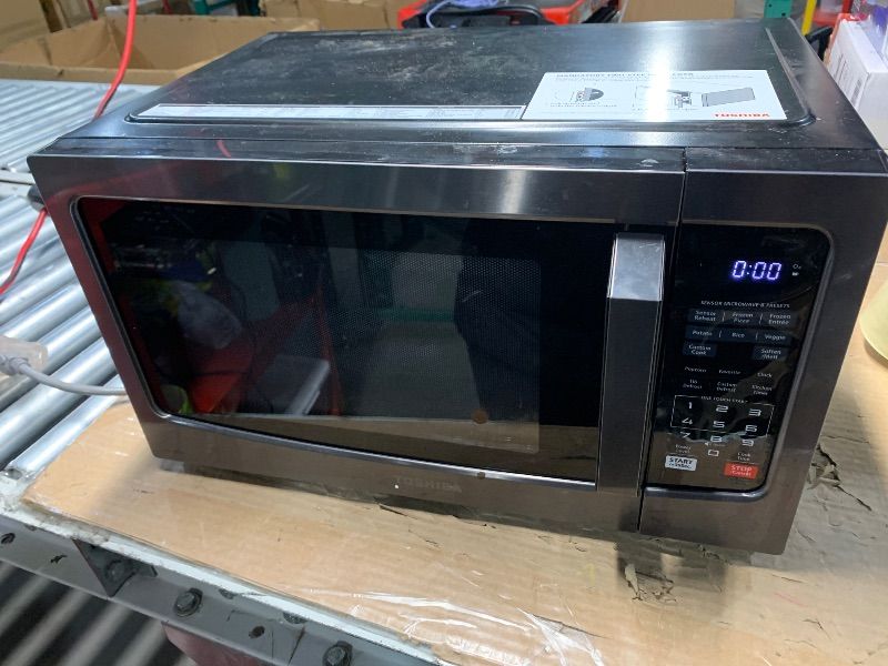 Photo 1 of **DIRTY, MISSING MICROWAVE PLATE AND TURNTABLE RING** TOSHIBA EM131A5C-BS Countertop Microwave Ovens 1.2 Cu Ft, 12.4" Removable Turntable Smart Humidity Sensor 12 Auto Menus Mute Function ECO Mode Easy Clean Interior Black Color 1000W