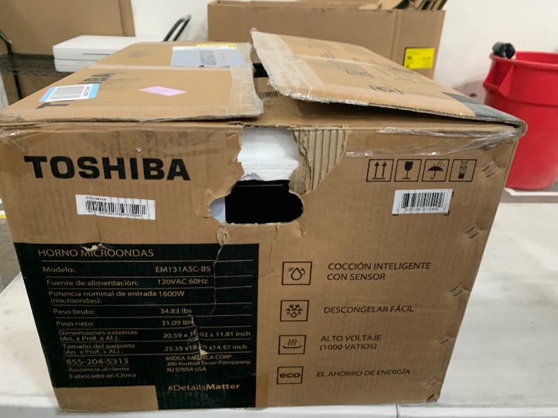 Photo 1 of **DIRTY, MISSING MICROWAVE PLATE AND TURNTABLE RING** TOSHIBA EM131A5C-BS Countertop Microwave Ovens 1.2 Cu Ft, 12.4" Removable Turntable Smart Humidity Sensor 12 Auto Menus Mute Function ECO Mode Easy Clean Interior Black Color 1000W