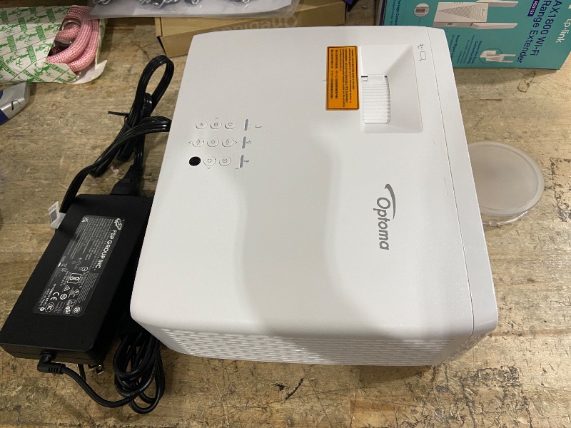 Photo 1 of **FOR PARTS, ITEM TURNS ON BUT DOES NOT FUNCTION**
Optoma UHZ35 High Brightness 4K UHD HDR Home Theater and Gaming Laser Projector