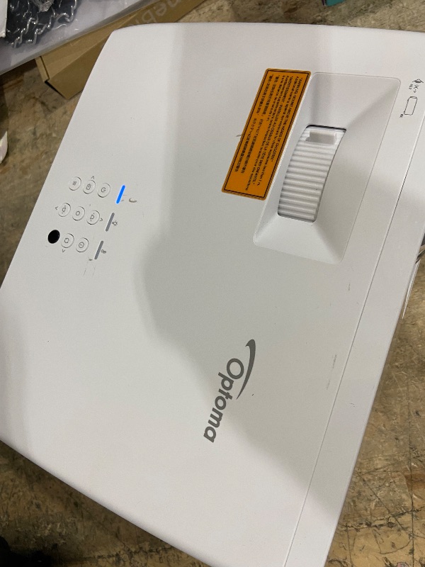 Photo 1 of **FOR PARTS, ITEM TURNS ON BUT DOES NOT FUNCTION**
Optoma UHZ35 High Brightness 4K UHD HDR Home Theater and Gaming Laser Projector